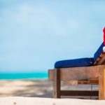 santa-hat-beach-lounger-christmas-vacation-concept_109800-8780